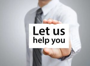 imgi 124 businessman showing card let us help you text holding 50241682